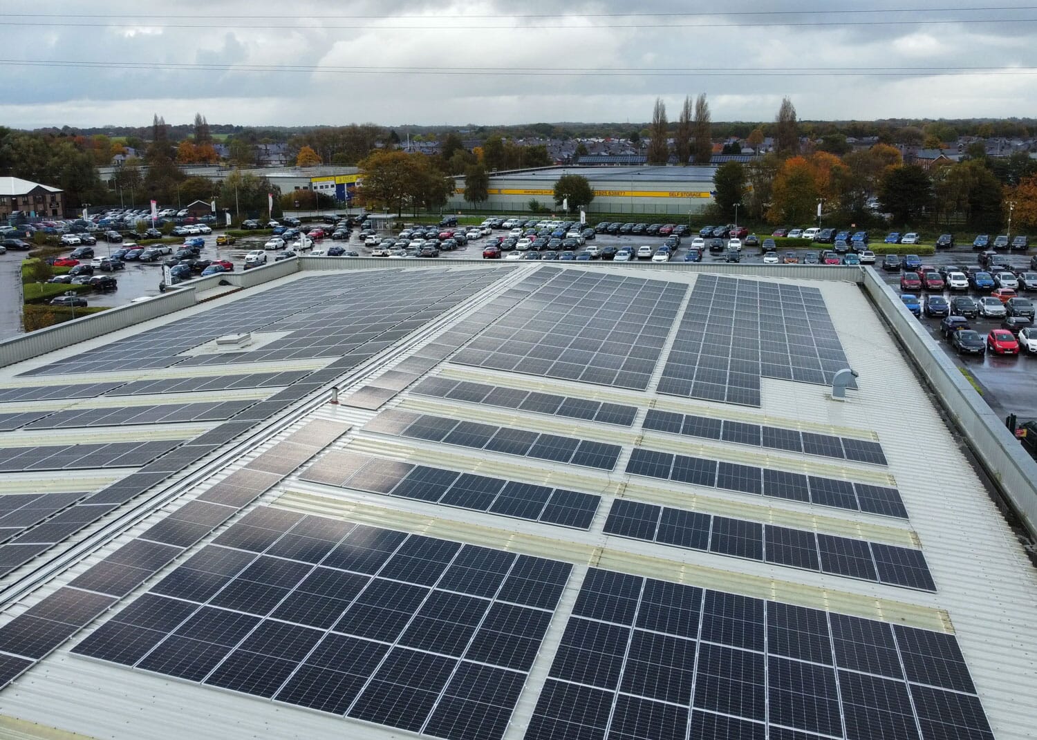 Large rooftop solar installation overlooking car park