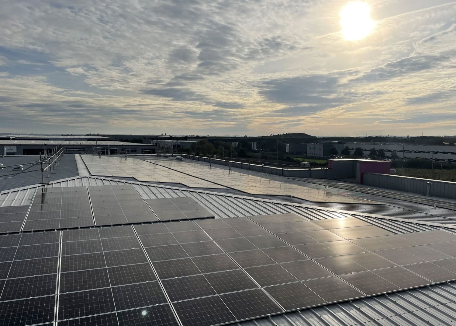 Rooftop solar installation at sunset
