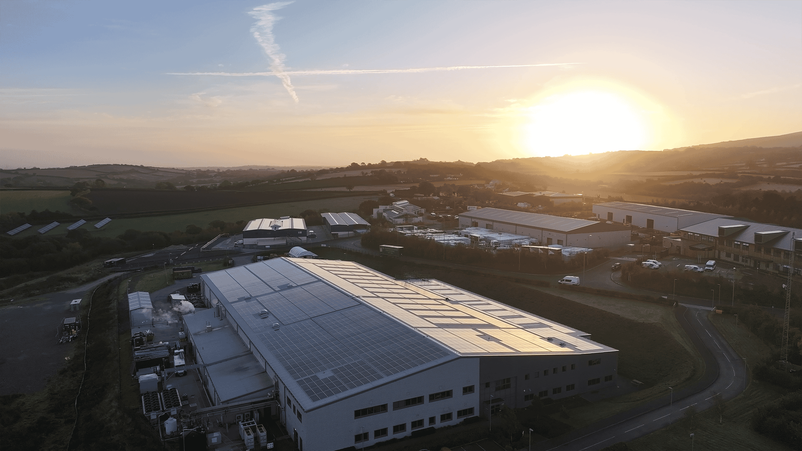 Solar panels on commercial roof at sunrise