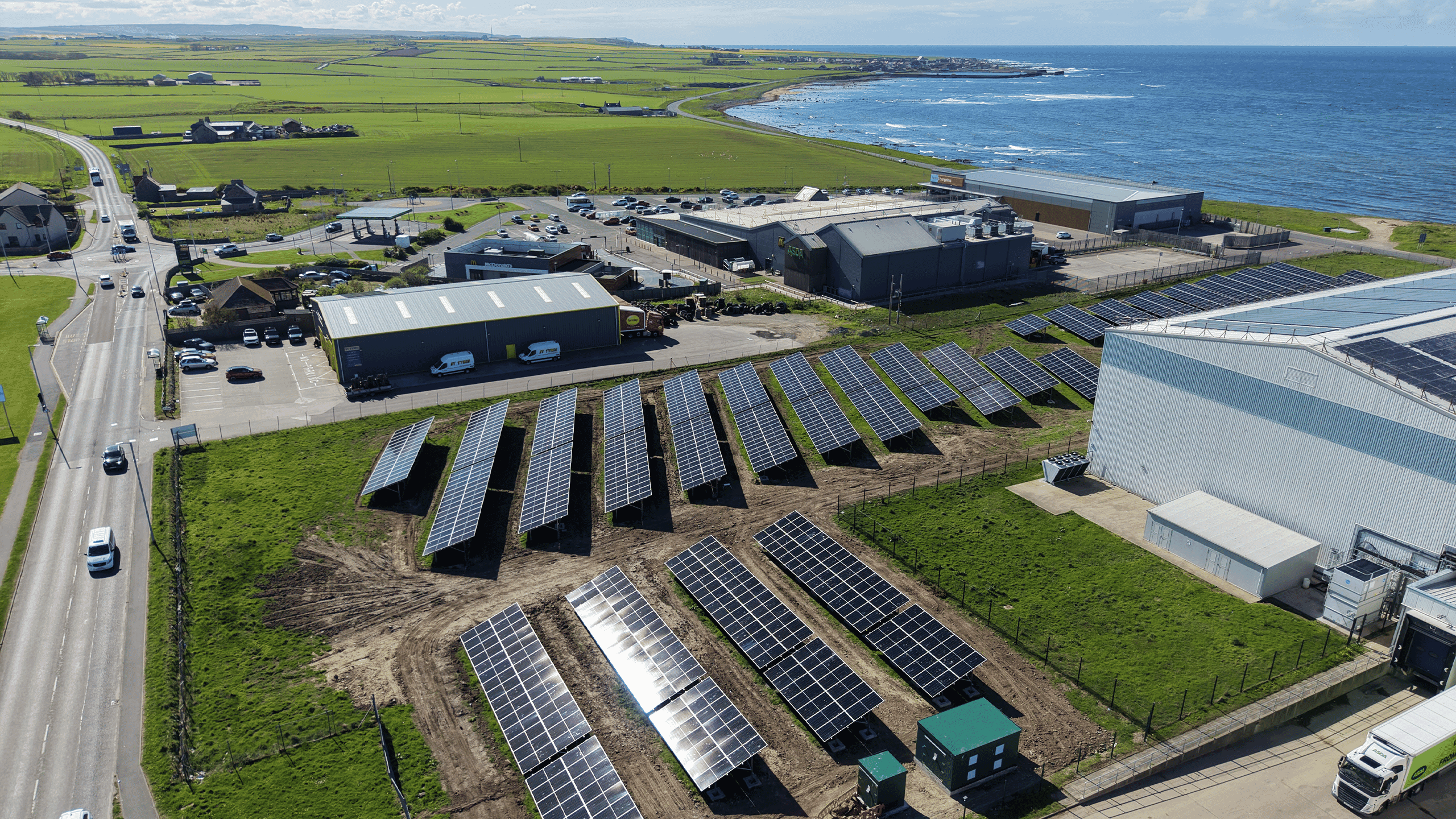 A solar array on a commercial site next to the coastline